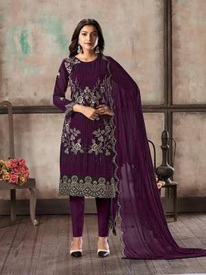Grab This Pretty Designer Straight Suit In Wine Color Paired With Blue Colored Bottom And Dupatta. Its Top and Dupatta Are Georgette Based Paired With Santoon Bottom. Its Top Is Beautified With Pretty Embroidery Giving An Elegant Look. 