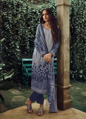 Add Some Casuals With This Printed Dress Material In Blue And Grey Color. Its Top And Bottom Are Crepe Based Paired With Georgette Fabricated Dupatta. It Is Light In Weight And Easy To Carry All Day Long. 
