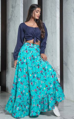 Look Pretty In This Trendy Pair Of Skirt And Top In Navy Blue Colored Top Paired With Turquoise Blue Colored Printed Skirt. Its Top Is Rayon Based Paired With Crepe Fabricated Skirt. Buy Now.