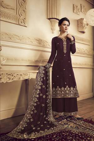 Flaunt Your Rich And Elegant Taste Wearing This Designer Straight Suit In Wine Color.  This Pretty Embroidered Suit Is Fabricated On Crepe Which Is Light Weight, Soft Towards Skin And Easy To Carry All Day Long. 