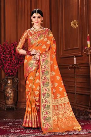 Adorn A Royal Looking Silk Based Designer Saree In Orange Color. This Saree And Blouse Are Fabricated On Art Silk Beautified With Attractive Weave. 