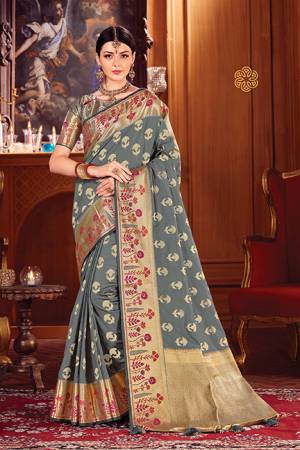 Adorn A Royal Looking Silk Based Designer Saree In Grey Color. This Saree And Blouse Are Fabricated On Art Silk Beautified With Attractive Weave. 