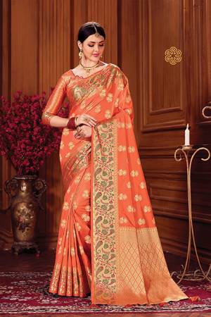 Adorn A Royal Looking Silk Based Designer Saree In Orange Color. This Saree And Blouse Are Fabricated On Art Silk Beautified With Attractive Weave. 