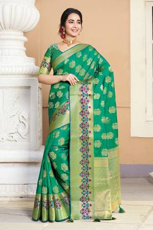 Celebrate This Festive Season In A Proper Traditional Look Wearing This Saree In Sea Green Color. This Saree And Blouse Are Fabricated On Art Silk Beautified With Weave Giving You An Attractive Look. 