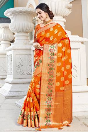 Celebrate This Festive Season In A Proper Traditional Look Wearing This Saree In Orange Color. This Saree And Blouse Are Fabricated On Art Silk Beautified With Weave Giving You An Attractive Look. 