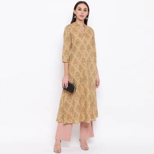 Here Is A Simple And Elegant Looking Readymade Kurti In Beige Color Fabricated On Cotton. This Kurti Is Light In Weight And Can Be Paired With Same Or Contrasting Colored Bottom