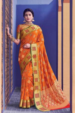 Look Attractive Wearing this Orange Colored Silk Based Saree Paired With Orange Colored Blouse. This Saree And Blouse Are Fabricated On Banarasi Silk Beautified With Weave. 