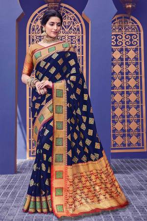 Look Attractive Wearing this Navy Blue Colored Silk Based Saree Paired With Red Colored Blouse. This Saree And Blouse Are Fabricated On Banarasi Silk Beautified With Weave. 