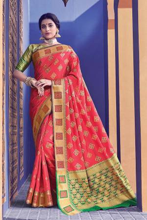 This Festive Season, Adorn A Proper Traditional Look Wearing This Saree In Pink Color Paired With Green Colored Blouse. This Saree And Blouse Are Fabricated On Banarasi Silk Beautified With Weave All Over. 