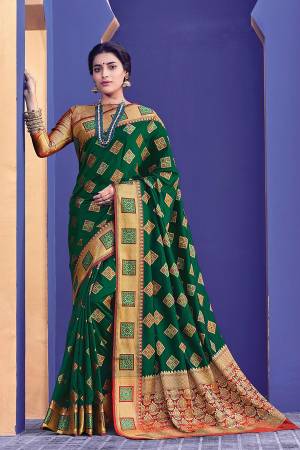 Look Attractive Wearing this Dark Green Colored Silk Based Saree Paired With Golden Colored Blouse. This Saree And Blouse Are Fabricated On Banarasi Silk Beautified With Weave. 