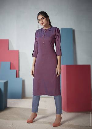 Add This Elegant Looking Plain Kurti To Your Wardrobe In Purple Color. This Readymade Straight Kurti Is Fabricated On Two Tone Rayon And Available In All Regular Sizes. 
