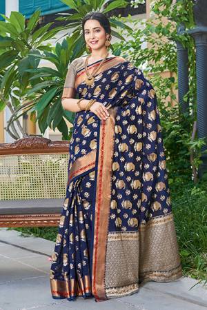 Grab This Very Pretty Designer Silk Based Saree In Navy Blue Color. This Saree And Blouse Are Fabricated On Handloom Silk Beautified with Weaved Motifs. It Is Light Weight, Durable And Easy To Care For.