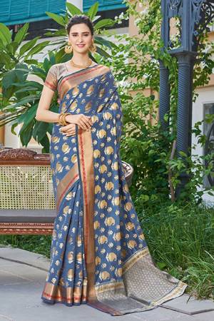 Grab This Very Pretty Designer Silk Based Saree In Steel Blue Color. This Saree And Blouse Are Fabricated On Handloom Silk Beautified with Weaved Motifs. It Is Light Weight, Durable And Easy To Care For.