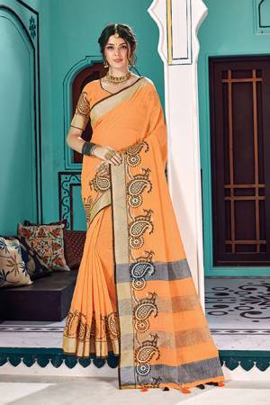 Simple And Elegant Looking Saree In Orange Color Paired With Orange Colored Blouse. This Saree And Blouse Are Fabricated On Linen Cotton Beautified With Weave. Buy Now.