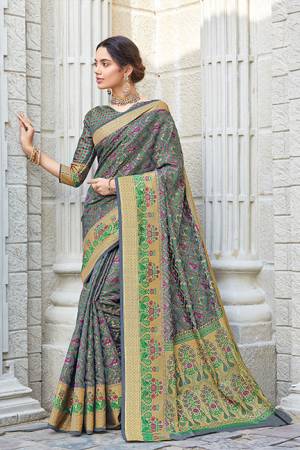 Celebrate This Festive Season Wearing This Designer saree In Grey Color. This Saree And Blouse Are Fabricated On Patola Silk Beautified With Weave. Its Fabric And Color Gives A Rich Look To Your Personality. 