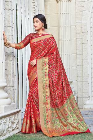 Celebrate This Festive Season Wearing This Designer saree In Red Color. This Saree And Blouse Are Fabricated On Patola Silk Beautified With Weave. Its Fabric And Color Gives A Rich Look To Your Personality. 