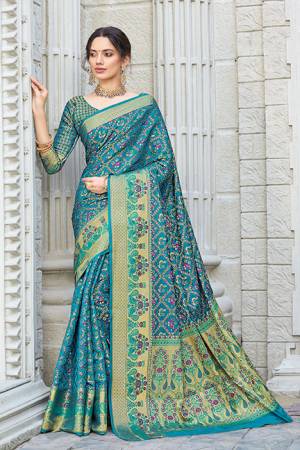Celebrate This Festive Season Wearing This Designer saree In Blue Color. This Saree And Blouse Are Fabricated On Patola Silk Beautified With Weave. Its Fabric And Color Gives A Rich Look To Your Personality. 