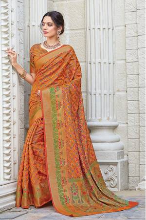 Celebrate This Festive Season Wearing This Designer saree In Orange Color. This Saree And Blouse Are Fabricated On Patola Silk Beautified With Weave. Its Fabric And Color Gives A Rich Look To Your Personality. 