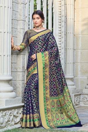 Celebrate This Festive Season Wearing This Designer saree In Navy Blue Color. This Saree And Blouse Are Fabricated On Patola Silk Beautified With Weave. Its Fabric And Color Gives A Rich Look To Your Personality. 