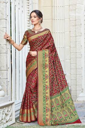 Celebrate This Festive Season Wearing This Designer saree In Maroon Color. This Saree And Blouse Are Fabricated On Patola Silk Beautified With Weave. Its Fabric And Color Gives A Rich Look To Your Personality. 