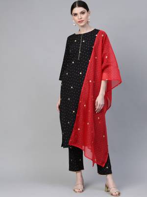 Grab This Pretty Readymade Suit In Black Color Paired With Red Colored Dupatta. Its Top and Bottom Are Crepe Based Paored With Orgenza Fabricated Dupatta. 