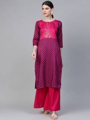Here Is A Simple Plazzo Set In Wine Colored Kurti Paired With Dark Pink Colored Bottom. This Readymade Pair Is Poly silk Based Which Gives A Rich Look To Your Personality. 