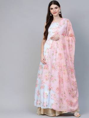 Celebrate This Festive Season Wearing This Pretty Floor Length Readymade Suit In Baby Blue Color Paired With A Baby Pink Colored Dupatta. This Pretty Top And Dupatta Are Beautified With Floral Prints. 