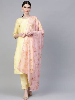 Look Pretty In This Elegant Looking Readymade Straight Suit In Yellow Color Paired With Baby Pink Colored Floral Printed Dupatta. Its Top And Bottom Are Poly Silk Based Paired With Chiffon Dupatta. 