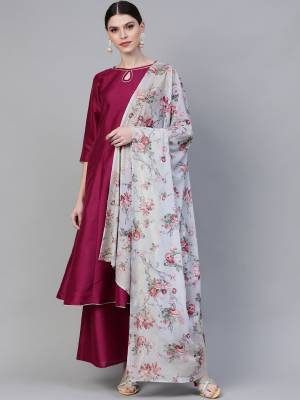 Enhance Your Personality Wearing This Readymade Suit In Wine Color Paired With Grey Colored Dupatta. Its Top and Bottom Are Silk Based Paired With Georgette Fabricated Floral Printed Dupatta. 