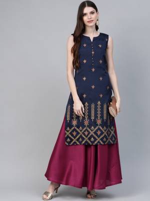 Grab This Pretty Pair Of Gown With A Over Top. This Gown Is In Magenta Pink Color Paired with Navy Blue Colored Top. This Readymade Indo Western Pair Is Silk Based. Its Rich Fabric And Unique Pattern Will Earn You Lots Of Compliments From Onlookers.