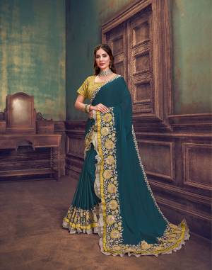 A sensational color combination of deep 
teal blue and mesmerizing shade of yellow , beige and gold will steal the heart ofthe wearer and the onlookers. With its maharani-like appeal , the saree is a heirloom piece anyone would want to save for the generations to come. 