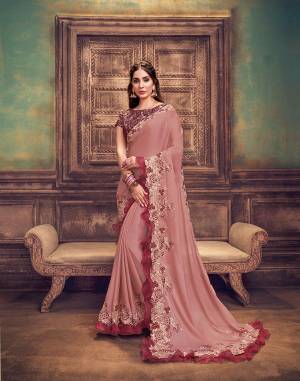 A romantic affair of old-rose pink silk-georgette fabric and an embellishment of soft floral resham and water-gold zari embroidery this silk georgette saree is perfect for your next occasion ? A design that represents the sheer essence of love with its hues and bringing it to life with frilly upliftments.