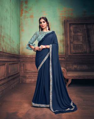 Classy, sophisticated , power-packed and artsy ? the  blue saree with its distinctive frill detailing over the shoulder pallu, the simple border details and our favourite part of the saree ? a beautiful handwork blouse- a decent pick for women of every personality and taste.