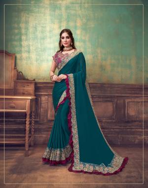 The future is simplicity and glamour combined with traditions. This deep jewel toned saree is with a contrasting wine resham and zari embroidery with prettiest frill additions this design is an apt pick for a women who wants her style to be unique while keeping her roots attached to the rich culture. 
