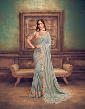 Every girl dreams to wear a saree ? a saree that would make her look youthful,fresh and subtle yet outstanding. This pastel saree in gentle shades of soft grey and powder pink , adorned with tonal floral embroidery details with just the right
amount of sheen and gorgeous frills is a masterpiece in its own.