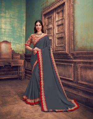 Neutral grey uplifted with the brightest and the moststunning shade of red ? this designer saree is apt for all occasions from a simple event to weddings. The versatility of the colors, the style and the simplicity is the USP of this product.
