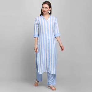 Grab This Simple And Elegant Readymade Pair Of Kurti and Plazzo In Blue and White Color. This Pretty Pair Is Fabricated On Rayon Beautified With Lining Prints. It Is Light In Weight And Easy To Carry All Day Long. 
