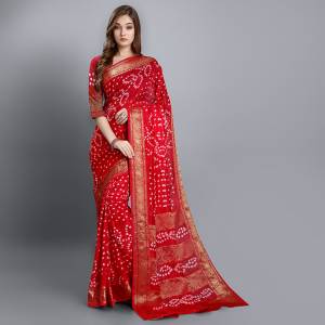 Celebrate This Festive Seasobn With Beauty and Comfort Wearing This Bandhani Prnted Saree In Red Color. This Saree and Blouse Are Fabricated On Viscose Georgette Which Is Light Weight And Ensures Superb Comfort Throughout The Gala.