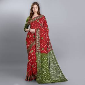 For A Proper Traditional Look, Grab This Pretty Saree In Red And Olive Green Color. This Saree and Blouse Are Viscose Georgette Based Beautified With Bandhani Prints. Buy This Pretty Saree Now.