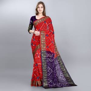 Celebrate This Festive Seasobn With Beauty and Comfort Wearing This Bandhani Prnted Saree In Red And Purple Color. This Saree and Blouse Are Fabricated On Viscose Georgette Which Is Light Weight And Ensures Superb Comfort Throughout The Gala.
