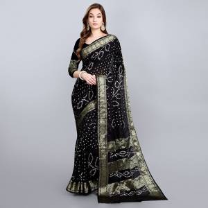 For A Proper Traditional Look, Grab This Pretty Saree In Black Color. This Saree and Blouse Are Viscose Georgette Based Beautified With Bandhani Prints. Buy This Pretty Saree Now.