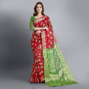 Celebrate This Festive Seasobn With Beauty and Comfort Wearing This Bandhani Prnted Saree In Red And Green Color. This Saree and Blouse Are Fabricated On Viscose Georgette Which Is Light Weight And Ensures Superb Comfort Throughout The Gala.