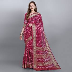 For A Proper Traditional Look, Grab This Pretty Saree In Magenta Pink Color. This Saree and Blouse Are Viscose Georgette Based Beautified With Bandhani Prints. Buy This Pretty Saree Now.