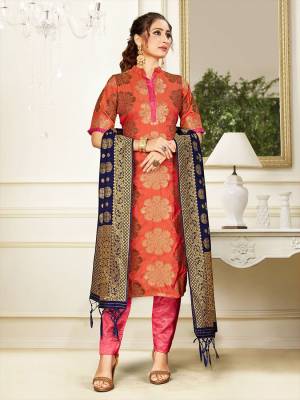 Celebrate This Festive Season Wearing this Designer Straight Suit In Orange And Pink Color Paired With Navy Blue Colored Dupatta. Its Top, Bottom And Dupatta Are Fabricated Banarasi Art Silk Beautified With Weave. Buy This  Suit Now.