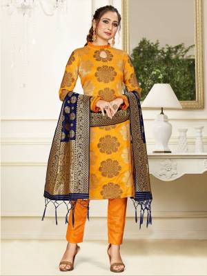 Celebrate This Festive Season Wearing this Designer Straight Suit In Musturd Yellow Color Paired With Navy Blue Colored Dupatta. Its Top, Bottom And Dupatta Are Fabricated Banarasi Art Silk Beautified With Weave. Buy This  Suit Now.