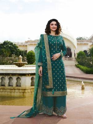 Flaunt Your Rich And Elegant Taste Wearing This Designer Straight Suit In Blue Color. This Pretty Top And Dupatta Are Fabricated On Jacquard Silk Paired With Art Silk Fabricated Bottom. Buy This Semi-Stitched Suit Now.