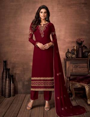 Here Is A Very Pretty Designer Straight Suit In Maroon Color. Its Embroidered Top and Dupatta Are Fabricated On Georgette Paired with Santoon Fabricated Bottom. Its Fabrics Are Soft Towards Skin And Esnures Superb Comfort All Day Long. 