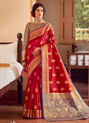 Celebrate This Festive Season In A Lovely Traditional Look Wearing This Designer saree In Red Color Paired With Purple Colored Blouse. This Saree And Blouse Are Fabricated On Handloom Silk Beautified With Heavy Weave.