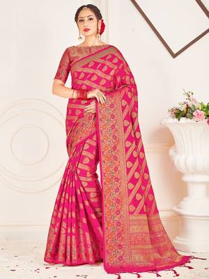 Adorn A Lovely Traditional Look Wearing This Pretty Silk Based Saree In Rani Pink Color. This Saree And Blouse Are Fabricated On Banarasi Art Silk Beautified With Weave All Over. Buy 