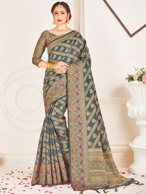 Adorn A Lovely Traditional Look Wearing This Pretty Silk Based Saree In Grey Color. This Saree And Blouse Are Fabricated On Banarasi Art Silk Beautified With Weave All Over. Buy 